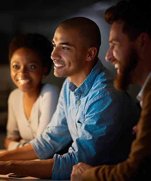 Three people reviewing project results